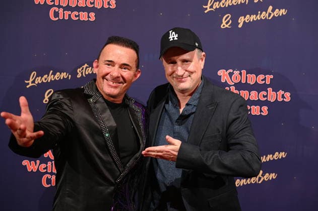 Presenter Markus Köllner and Olli Briesch , l r, attend the premiere of the 10th Cologne Christmas Circus