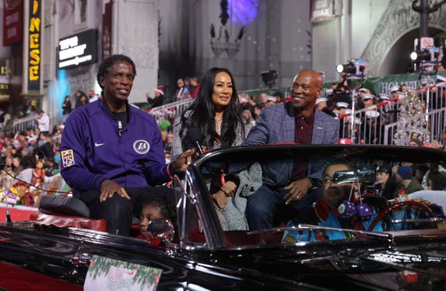 A. C. Green, Cecelia Scott and Byron Scott cruise down Hollywood Blvd. during The 93rd Annual Hollywood Christmas Parade With Grand Marshal Luke Wilson In Support of Marine Toys for Tots in Los Angeles on Sunday, November 30, 2025.  LAP20251130746 GERGxGRUDT