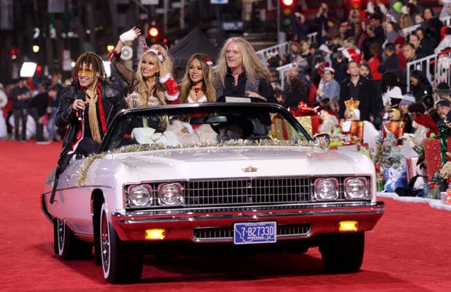 Jason Ebs, Janea Ebs, Suzanne Le Bach and Sebastian Bach cruise down Hollywood Blvd. during The 93rd Annual Hollywood Christmas Parade With Grand Marshal Luke Wilson In Support of Marine Toys for Tots in Los Angeles on Sunday, November 30, 2025.  LAP20251130748 GERGxGRUDT