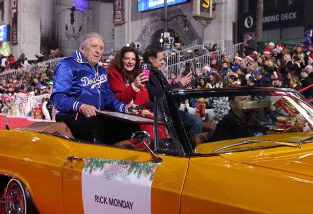 Rick Monday and Barbaralee Monday cruise down Hollywood Blvd. during The 93rd Annual Hollywood Christmas Parade With Grand Marshal Luke Wilson In Support of Marine Toys for Tots in Los Angeles on Sunday, November 30, 2025.  LAP20251130783 GERGxGRUDT