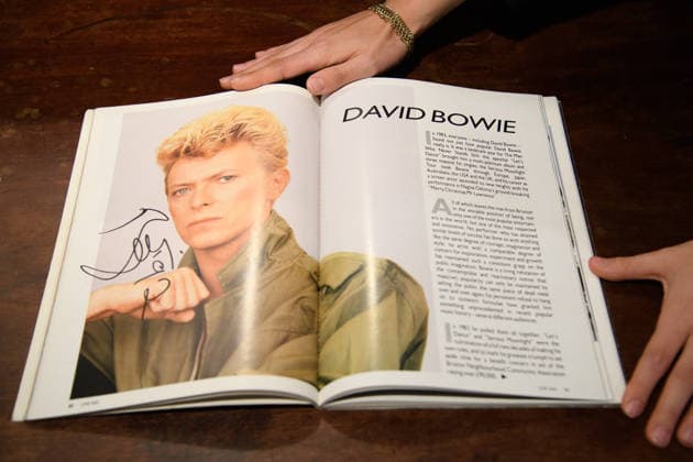 Bonhams Sound & Cinema: With Property from The Marianne Faithfull Estate Sale - Bonhams, London, UK - 1 December 2025 A staff member views An Autographed Live Aid Programme featuring David Bowie s autograph (est. Â£3k - Â£4k) which is on auction at Bonhams Sound & Cinema: With Property from The Marianne Faithfull Estate Sale ending from 3rd December 2025 at Bonhams in London, England, UK on Monday 1 December, 2025., Credit:Justin Ng Avalon UK, England, London, Bonhams  Copyright: xJustinxNgx xAvalonx 1055809893