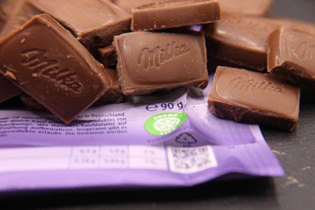 Pieces of a Milka Alpenmilch chocolate bar lying on a slate Schnelsen Hamburg