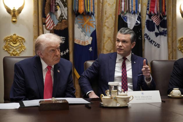 President Donald Trump looks on as Secretary of Defense Pete Hegseth speaks during a Cabinet in the Cabinet Room of the White House in Washington, DC on Tuesday, December 2, 2025. WAX20251202822 YurixGripas