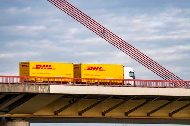 Truck, truck with trailer, of the logistics company DHL, courier company, parcel deliveries, A42 bridge over the Rhine near Duisburg Beeckerwerth, truck traffic
