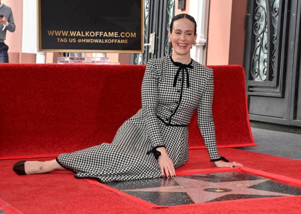 Actress Sarah Paulson (L) sits beside her star during an unveiling ceremony honoring her with the 2,829th star on the Hollywood Walk of Fame in Los Angeles on Tuesday, December 2, 2025.  LAP2025120214 JIMxRUYMEN