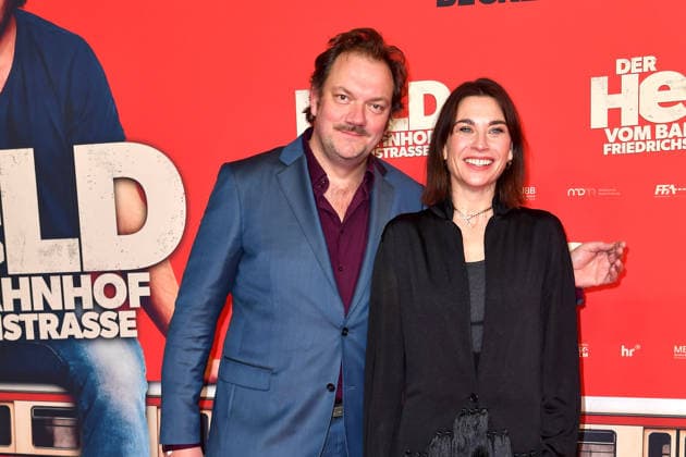Charly Hübner and Christiane Paul at the premiere of DER HELD VOM BAHNHOF FRIEDRICHSTRASSE at the Delphi Filmpalast in Berlin 02 12 2025