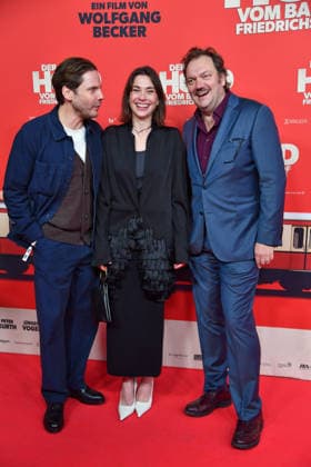 Daniel Brühl, Christiane Paul and Charly Hübner at the premiere of DER HELD VOM BAHNHOF FRIEDRICHSTRASSE at the Delphi Filmpalast in Berlin 02 12 2025