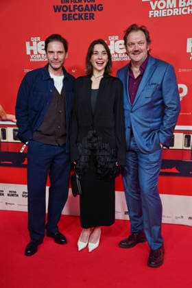 Daniel Brühl, Christiane Paul and Charly Hübner at the premiere of DER HELD VOM BAHNHOF FRIEDRICHSTRASSE at the Delphi Filmpalast in Berlin 02 12 2025
