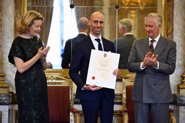 Queen Mathilde of Belgium, Philippe Abelew of Maison Bouvy and King Philippe - Filip of Belgium pose for the photographer during a royal reception with the newly appointed suppliers holding a Royal warrant of appointment (Brevet van Hofleverancier - Brevet de Fournisseurs de la cour), at the Royal Palace, in Brussels, Wednesday 03 December 2025.  ERICxLALMAND 146115295