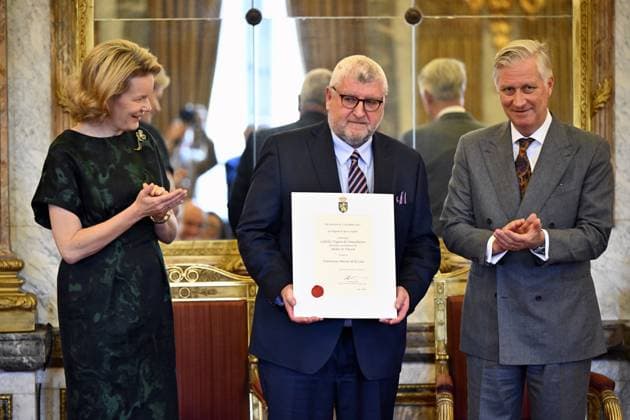 Queen Mathilde of Belgium, Ladislas Nagant de Deuxchaisnes of Atelier St Vincent and King Philippe - Filip of Belgium pose for the photographer during a royal reception with the newly appointed suppliers holding a Royal warrant of appointment (Brevet van Hofleverancier - Brevet de Fournisseurs de la cour), at the Royal Palace, in Brussels, Wednesday 03 December 2025.  ERICxLALMAND 146115353