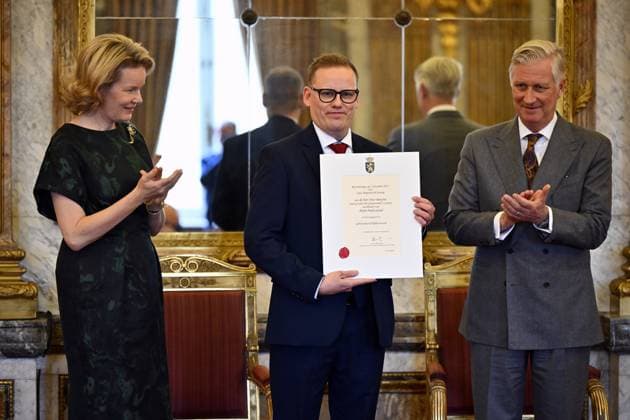 Queen Mathilde of Belgium, Niko Bayens of Miele Professional and King Philippe - Filip of Belgium pose for the photographer during a royal reception with the newly appointed suppliers holding a Royal warrant of appointment (Brevet van Hofleverancier - Brevet de Fournisseurs de la cour), at the Royal Palace, in Brussels, Wednesday 03 December 2025.  ERICxLALMAND 146115371