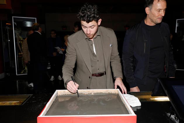 December 3, 2025, Los Angeles, California, USA: Nick Jonas at a ceremony honoring the Jonas Brothers with hand and foot prints at the TCL Chinese Theatre IMAX. Los Angeles USA - ZUMAg107 20251203_zep_g107_050 Copyright: xNinaxPrommerx