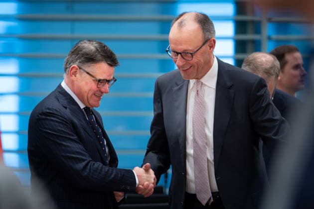 Opening pictures of the Minister Presidents Conference in the Federal Chancellery Chancellor Friedrich Merz CDU welcomes Boris Rhein CDU Minister President of Hesse in a good mood at the opening of the Minister Presidents Conference in the Federal Chancellery Berlin 04 12 2025 Berlin Berlin Germany