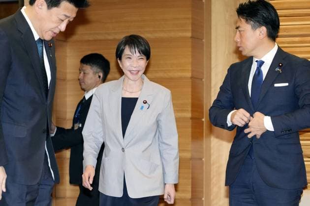 Japan PM Takaichi Japanese Prime Minister Sanae Takaichi (C) heads to a Cabinet meeting at her office in Tokyo on Dec. 5, 2025.  A14AA0005089329P