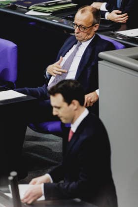 L R Friedrich Merz CDU , Federal Chancellor, and Pascal Reddig, Member of the German Bundestag CDU and Chairman of the Young Group of the CDU CSU, recorded during the debate on the pension package in the German Bundestag in Berlin, 05 12 2025 The Young Group of the CDU CSU parliamentary group threatens to reject the package, which could lead to a cri Copyright: xFlorianxGaertnerx