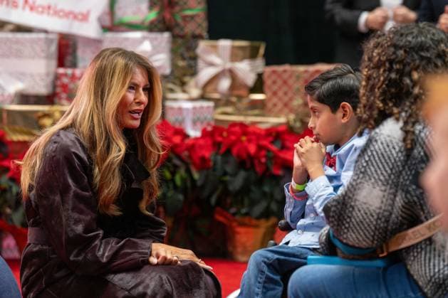 December 5, 2025, Washington, District Of Columbia, USA: First Lady MELANIA TRUMP speaks with a child and his parent during her visit to the ChildrenÃ¢â‚¬â ¢s National Hospital. Washington USA - ZUMAs365 20251205_znp_s365_008 Copyright: xJoeyxSussmanx