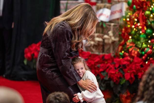 December 5, 2025, Washington, District Of Columbia, USA: A little girl runs up and hugs First Lady MELANIA TRUMP during her visit to the ChildrenÃ¢â‚¬â ¢s National Hospital. Washington USA - ZUMAs365 20251205_znp_s365_010 Copyright: xJoeyxSussmanx