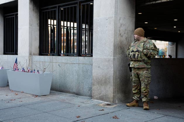 Members of the National Guard patrol near the location of a shooting that killed one National Guard member and left another in critical condition last month outside the Farragut West Metro Station in Washington DC on Sunday, December 7, 2025. A 29-year-old suspect pled not guilty to murder and assault charges earlier this week.  WAP2025120725004 AARONxSCHWARTZ