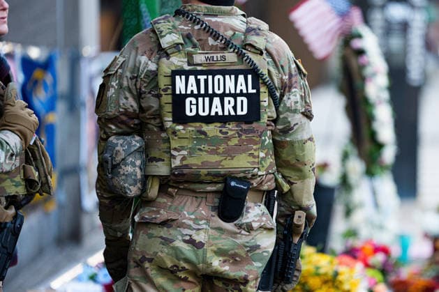 Members of the National Guard patrol near the location of a shooting that killed one National Guard member and left another in critical condition last month outside the Farragut West Metro Station in Washington DC on Sunday, December 7, 2025. A 29-year-old suspect pled not guilty to murder and assault charges earlier this week.  WAP2025120725009 AARONxSCHWARTZ