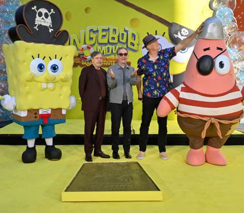 Mark Hamill, Tom Kenny, the voice of SpongeBob, and Bill Fagerbake, the voice of Patrick (L-R) participate in a hand and footprint ceremony immortalizing SpongeBob in the forecourt of the TCL Chinese Theatre (formerly Grauman s) in the Hollywood section of Los Angeles on Tuesday, December 16, 2025.  LAP20251216422 JIMxRUYMEN