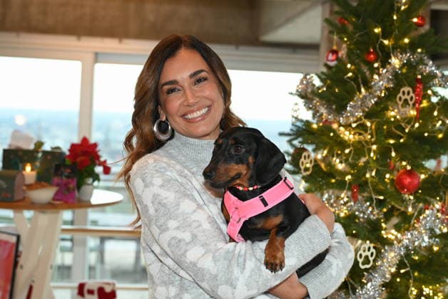 Jana Ina Zarrella poses with her dog Mimi at the presentation of dog cookies alla Stefano Zarrella un Biscotto per Naturale in cooperation with the premium dog food manufacturer Animonda