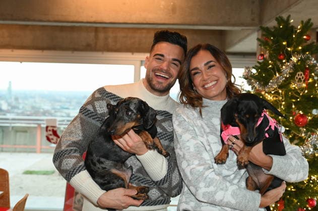 Stefano Zarrella with dog Rocky and Jana Ina Zarrella with dog Mimi pose at the presentation of dog cookies alla Stefano Zarrella un Biscotto per Naturale in cooperation with the premium dog food manufacturer Animonda