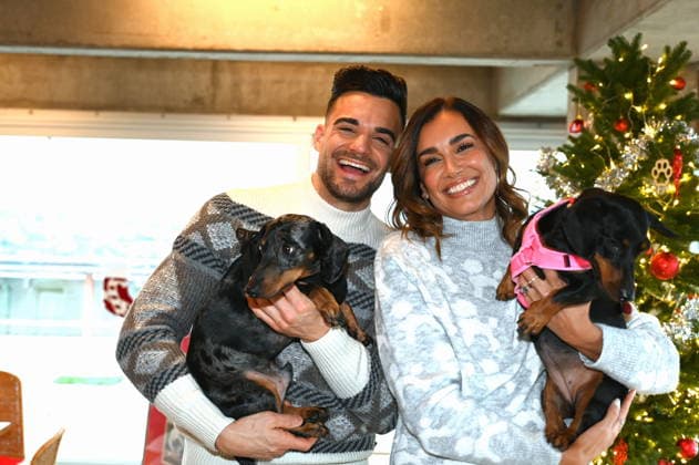 Stefano Zarrella with dog Rocky and Jana Ina Zarrella with dog Mimi pose at the presentation of dog cookies alla Stefano Zarrella un Biscotto per Naturale in cooperation with the premium dog food manufacturer Animonda