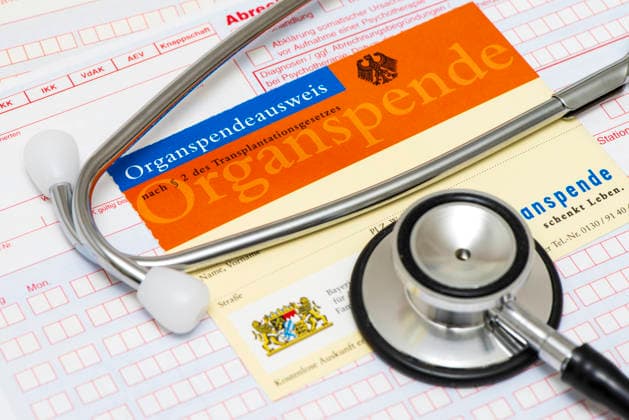 Organ donation A stethoscope lies on an organ donor card as a symbol for the willingness to donate organs after ones own death