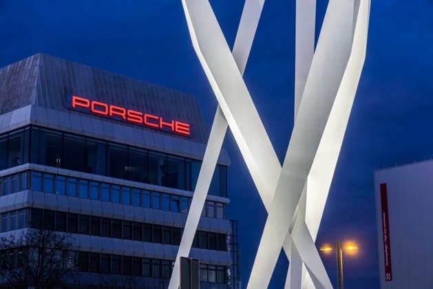 Porscheplatz in Zuffenhausen in the evening Between the Porsche Museum and headquarters, the artwork Inspiration 911 by Gerry Judah Three steles, each up to 24 meters high, present a Porsche 911 19 12 2025 Stuttgart, Baden Württemberg, Germany