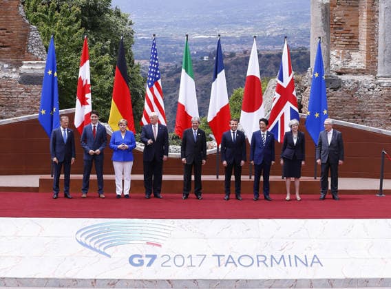 G7 Taormina Summit TAORMINA, ITALY - MAY 26 : (From L to R) European Council President Donald Tusk, Canadian Prime Minister Justin Trudeau, German Chancellor Angela Merkel, U.S. President Donald Trump, Italian Prime Minister Paolo Gentiloni, French President Emmanuel Macron, Japanese Prime Minister Shinzo Abe, British Prime Minister Theresa May and European Commission President Jean-Claude Juncker pose for the group photo in the ancient amphitheater at the G7 Taormina summit on the island of Sicily in Taormina, Italy on May 26, 2017. Sicilya Italy. Editorial use only. Please get in touch for any other usage. Copyright: x2025xAnadoluxMehmetxAlixÖzcanx