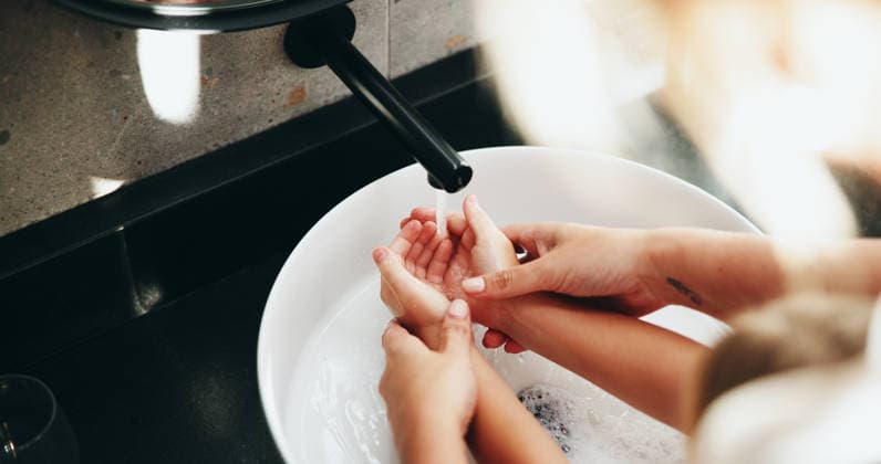Family, tap and washing hands with water in sink for hygiene, disinfection or cleanliness at home. Parent, child and rinse with kid, faucet or basin in bathroom for bacteria or germ removal at house Family, tap and washing hands with water in sink for hygiene, disinfection or cleanliness at home. Parent, child and rinse with kid, faucet or basin in bathroom for bacteria or germ removal at house., model released, , 96817420.jpg RECORD DATE NOT STATED