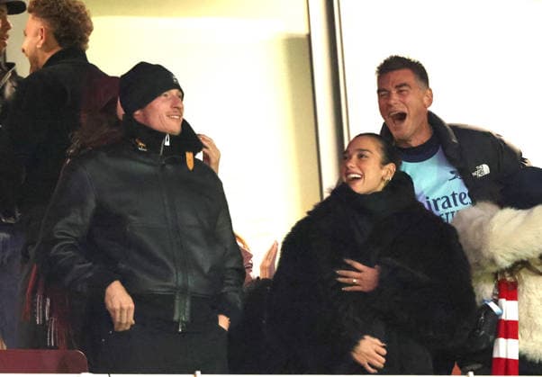 Dua Lipa celebrates an Arsenal goal, alongside Callum Turner at the Arsenal v Aston Villa EPL match, at the Emirates Stadium, London, UK on 30th December, 2025. 