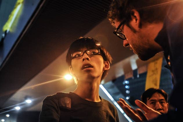 Pro-democracy demonstrations in Hong Kong HONG KONG - OCTOBER 9: 17 year-old student leader Joshua Wong speaks to protesters outside Hong Kong s Government complex on October 9, 2014. Protesters continued to block main transport routes, after a peaceful night of demonstrations in the Chinese territory. Hong Kong World. Editorial use only. Please get in touch for any other usage.  Copyright: x2025xAnadoluxThomasxCampeanx