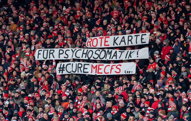 Soccer, Men, Season 2025 2026, 1 Bundesliga 16 Matchday , 1 FC Union Berlin 1 FSV Mainz 05, Fans of Union with banners Red Card for Psychosomatics CureMECFS, 10 01 2026, Copyright: xSebastianxRäppold MatthiasxKochx