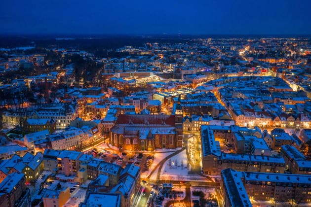 Winter in Cottbus DEU Germany Brandenburg Cottbus, 12 01 2026, Winter in Cottbus, night shot of the wintry city of Cottbus with snow on the roofs of the city In the foreground the Cottbus Oberkirche aerial view with a drone AF_Cottbus_32559