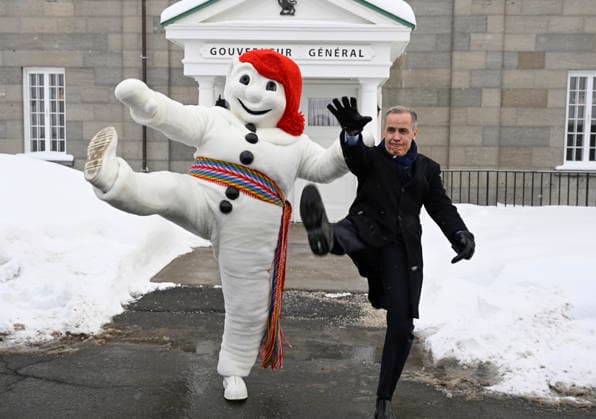January 22, 2026, Quebec, Pq, Canada: Prime Minister Mark Carney, right, and Bonhomme Carnaval raise their legs together in a traditional carnival kick, at the beginning of a Cabinet planning forum at the Citadelle in Quebec City, Thursday, Jan. 22, 2026. Quebec Canada - ZUMAc35_ 20260122_zaf_c35_018 Copyright: xJacquesxBoissinotx