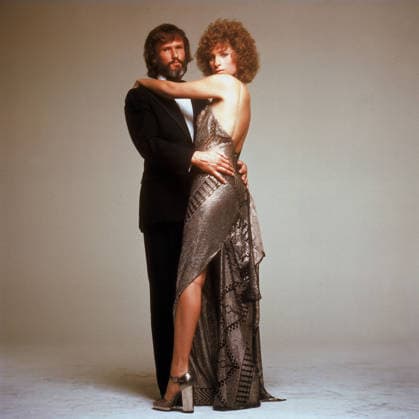 A Star is Born 1976 A Star is Born 1976: Talented rock star John Norman Howard has seen his career begin to decline. Too many years of concerts and managers and life on the road have made him cynical and the monotony has taken its toll. Then he meets the innocent, pure and very talented singer Esther Hoffman. As one of his songs in the movie says I m gonna take you girl, I m gonna show you how. He shows Esther the way to stardom while forsaking his own career. As they fall in love, her success only makes his decline even more apparent. PICTURED: BARBRA STREISAND as and KRIS KRISTOFFERSON Copyright: xEntertainmentxPicturesx