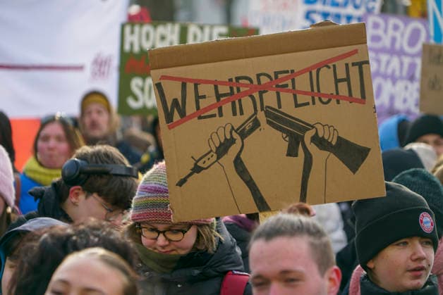 cntv Several hundred students of different ages demonstrated today with placards banners signs with different inscriptions on the street against the protest military service in the city center of Hamburg on 20 02 2026 Hamburg Germany