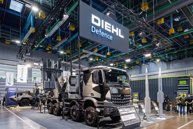 Opening day of the Enforce Tac trade fair for security and defense, Nuremberg, 23 02 2026 At the Diehl Defence stand, the IRIS T SLM air defense system is exhibited on a Mercedes Benz military truck Several vertical launch modules are installed on the loading area In addition, guided missile models are positioned Nuremberg Bavaria Germany 20260223-286A9064-M4000