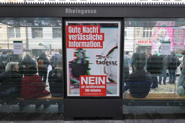 23 02 2026 Basel, SWITZERLAND, A No poster for the halving initiative SRG initiative at a streetcar stop Referendum on March 8, 2026