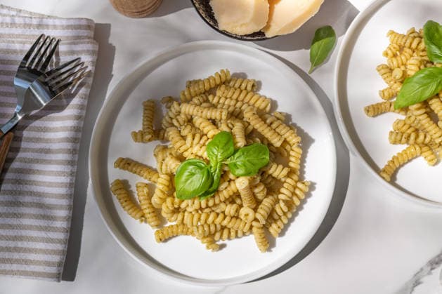 Penne pasta with fresh basil pesto garnished beautifully Delicious plates of penne pasta tossed in a vibrant basil pesto sauce. The dish is garnished with fresh basil leaves, offering a tempting and aromatic Italian meal. Model Released AnnaFedorovaPhoto_ID33124_1126940_003 Copyright: xAnnaxFedorovaxPhotox RECORD DATE NOT STATED