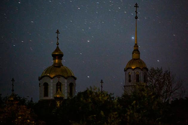 August 21, 2022, Kramatorsk, Donetsk Oblast, Ukraine: Stars are visible behind the Svyato-Troyistkyy Sobors church steeples in the Kramatorsk. The trail was captured during a 25 second exposure. Russian troops are attempting to conquer the Donbas region. Kramatorsk Ukraine - ZUMAc244 20220821_zip_c244_001 Copyright: xDanielxCardex