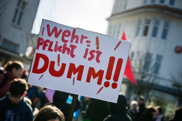 Students demonstrate against possible reintroduction of compulsory military service Oldenburg, Germany, 05 03 2026 Participants of a school strike against a possible reintroduction of compulsory military service hold a protest poster with the inscription Conscription is stupid during a demonstration.