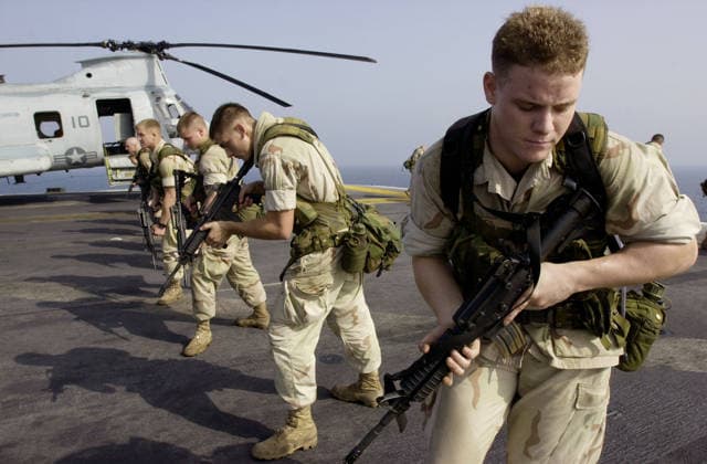 California News - October 29, 2001 (PUBLISHED 10 31 2001, A-3) - ER30oct0103-ABOARD THE USS PELELIU SOMEWHERE IN THE ARABIAN SEA-- Marine Lance Cpl. Clinton J. Bates, from Hugonton, Kansas, practices weapons drills on the flight deck of the USS Peleliu Oct. 30. Bates, who is assigned to the lst Light Armored Reconnaissance Battalion s detachment from Camp Pendleton, and other Marines are here in support of Operation Enduring Freedom. POOL PHOTO by Earnie Grafton Union-Tribune CAMP RHINO California AFG Copyright: xEarniexGraftonx