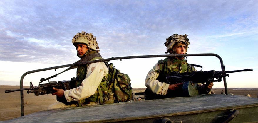 Operation Enduring Freedom Dec 17, 2001; Camp Rhino, Afghanistan; Cpl. ANTHONY CARDENAS (L), and Cpl. PPAUL VELEZ-SALAZAR (R), man their squad automatic weapons atop a humvee before going on patrol. Camp Rhino California USA Copyright: xEarniexGraftonx