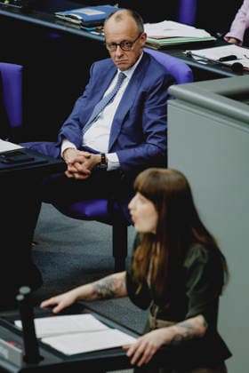 L R Friedrich Merz CDU , Federal Chancellor, and Heidi Reichinnek, Member of the German Bundestag Die Linke , taken during the debate on the government declaration in the German Bundestag in Berlin, 18 03 2026 Berlin Germany Copyright: xFlorianxGaertnerx