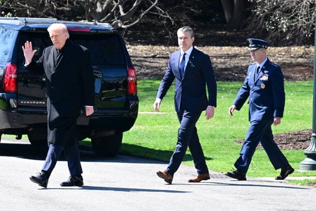 President Donald Trump Departs The White House (INT) President Donald Trump gestures a wave as he departs the White House with United States Secretary of War Pete Hegseth and United States Chairman of the Joint Chiefs of Staff Dan Caine in Washington, D.C., on March 18, 2026 for a trip to Dover Air Force Base for a dignified transfer where the remains of six U.S. service members killed in the crash of a refueling aircraft are returned to their families. It will be the second time since launching the war with Iran on Feb. 28 that the Republican president will attend the solemn military ritual known as a dignified transfer, which he once described as the toughest thing he has had to do as commander in chief. Credit: Kyle Mazza Thenews2  Copyright: xKylexMazzax