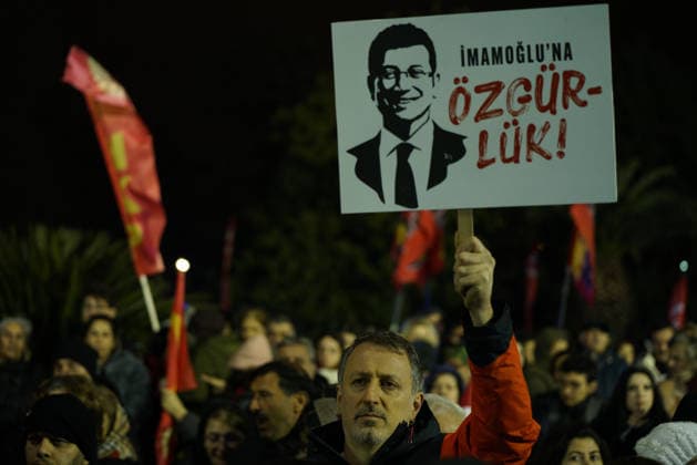 March 18, 2026, Fatih, Istanbul, Turkey: A person holds a placard reading Freedom for Imamoglu outside the Istanbul Metropolitan Municipality building during a rally to protest the first anniversary of the arrest of Istanbul Mayor Ekrem Imamoglu, the mayor of Istanbul in Istanbul, Turkey on March 18, 2026. Fatih Turkey - ZUMAu194 20260318_zip_u194_021 Copyright: xTolgaxUluturkx