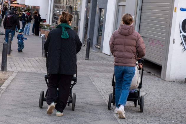 Two women pushing strollers in Berlin s Prenzlauer Berg neighborhood Two women pushing strollers in Berlin s Prenzlauer Berg neighborhood Two women pushing strollers in Berlin s Prenzlauer Berg neighborhood sp2026031920929.jpg
