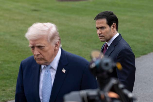 March 20, 2026, Washington, District Of Columbia, United States: U.S. Secretary of State Marco Rubio looks on as U.S. President Donald Trump speaks to journalists before departing the White House on March 20, 2026, in Washington D.C. President Trump is traveling to Florida to spend the weekend at his Mar-a-Lago resort. Washington United States - ZUMAe119 20260320_znp_e119_006 Copyright: xMehmetxEserx